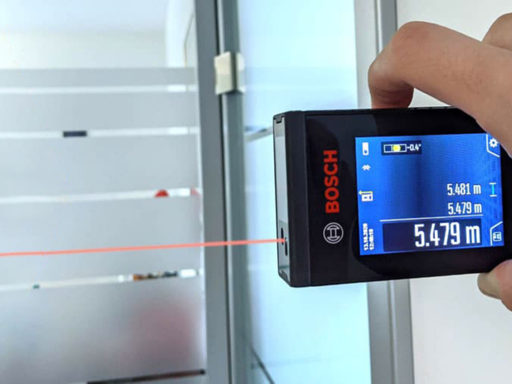 Room Survey - Bosch laser distance meter measuring a room for a floor plan