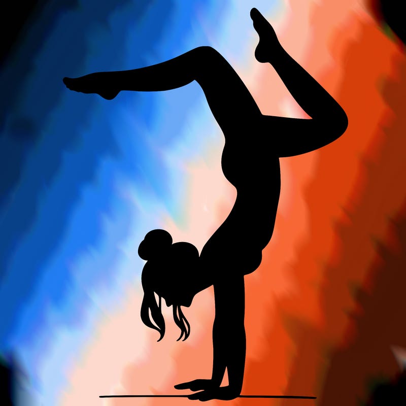 a woman doing a handstand
