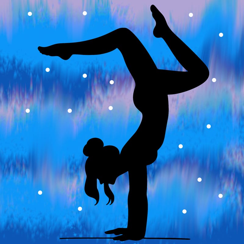 a woman doing a handstand