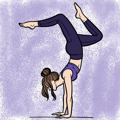 a woman doing a handstand
