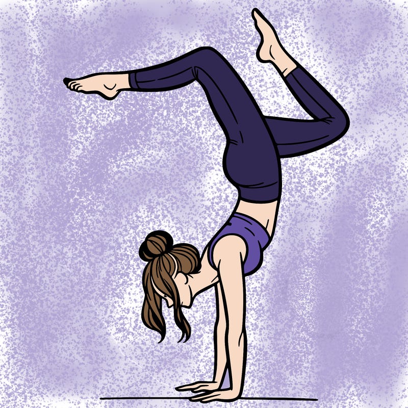a woman doing a handstand