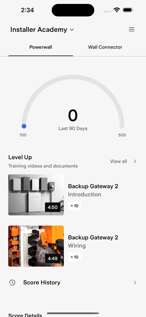 Interface do aplicativo Tesla One Installer Academy apresentando vídeos de treinamento do Powerwall e guias de instalação.