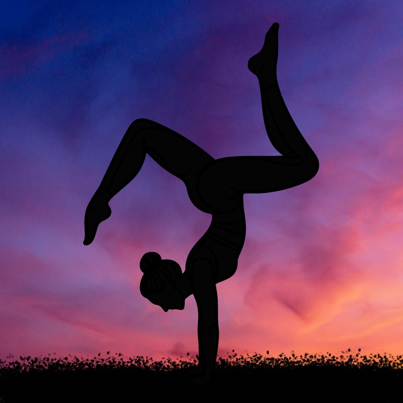 a woman doing a handstand