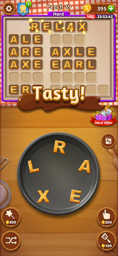 A screenshot of Word Cookies mobile game showing alphabet cookies on a baking pan and a completed word grid.
