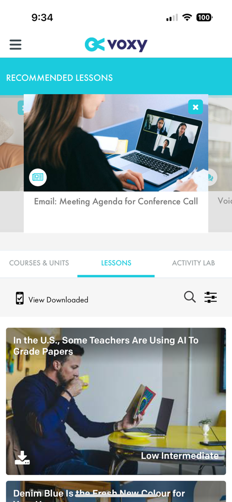 Voxy app interface showing professional English lessons on business meetings and news topics