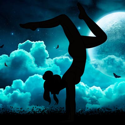 a woman doing a handstand