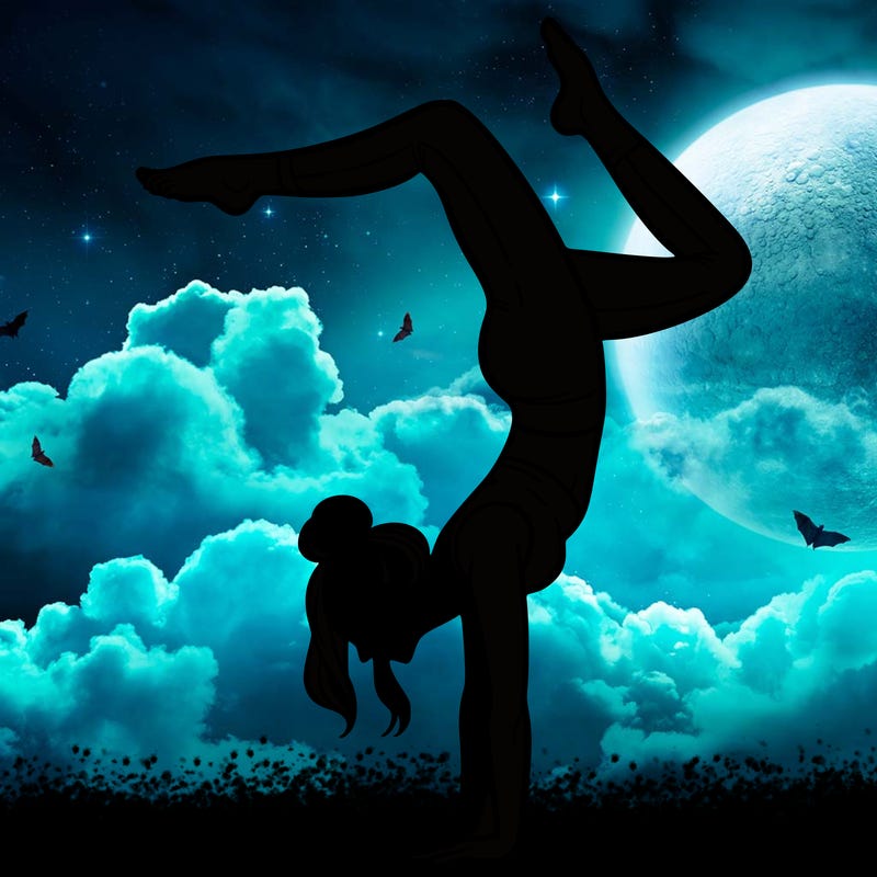 a woman doing a handstand