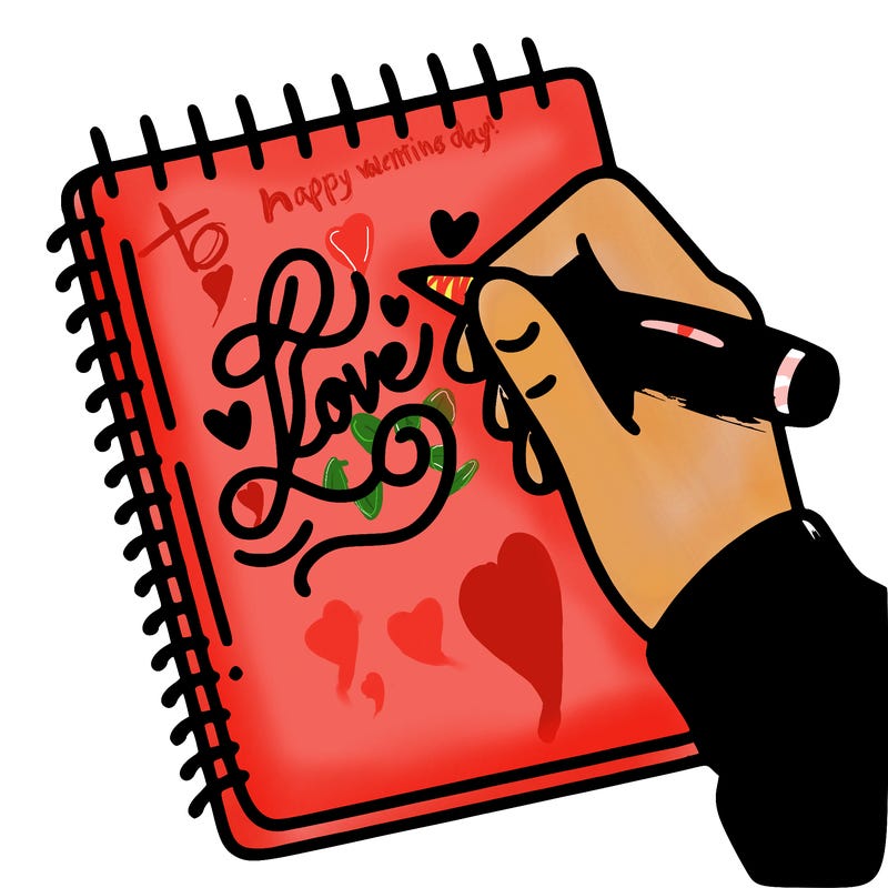 a hand writing “love” in calligraphy on a notebook