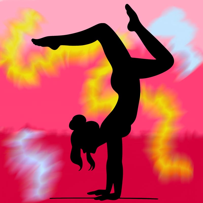 a woman doing a handstand