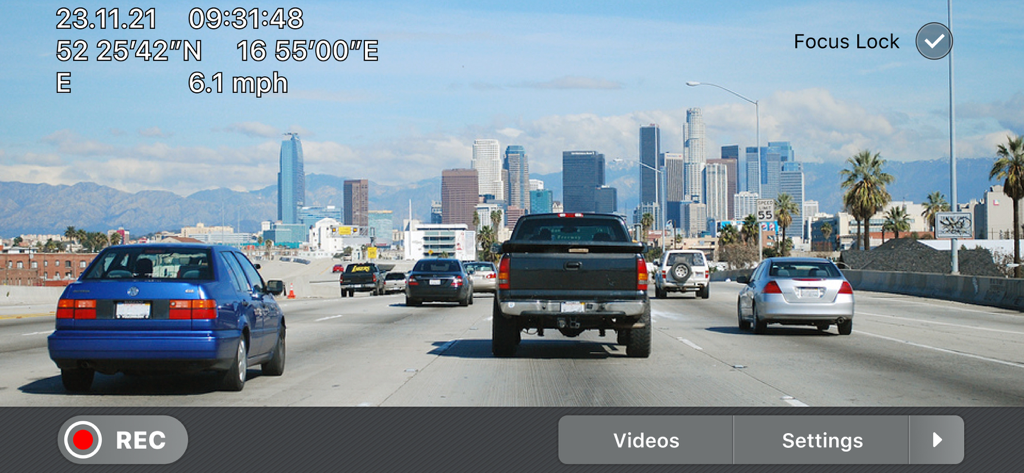 Smartphone dash cam app recording a city highway with speed and GPS data
