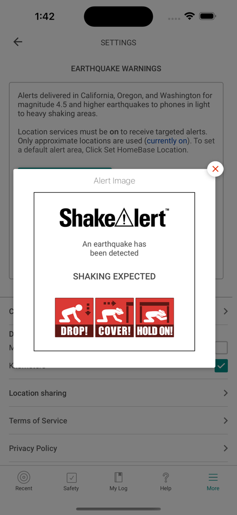 Uma notificação do ShakeAlert no aplicativo MyShake exibindo instruções para abaixar, cobrir e segurar durante um terremoto.