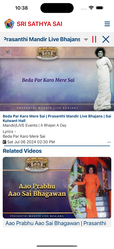Prasanthi Connect - A screen from the Prasanthi Connect app showing a live bhajan video player with related devotional content