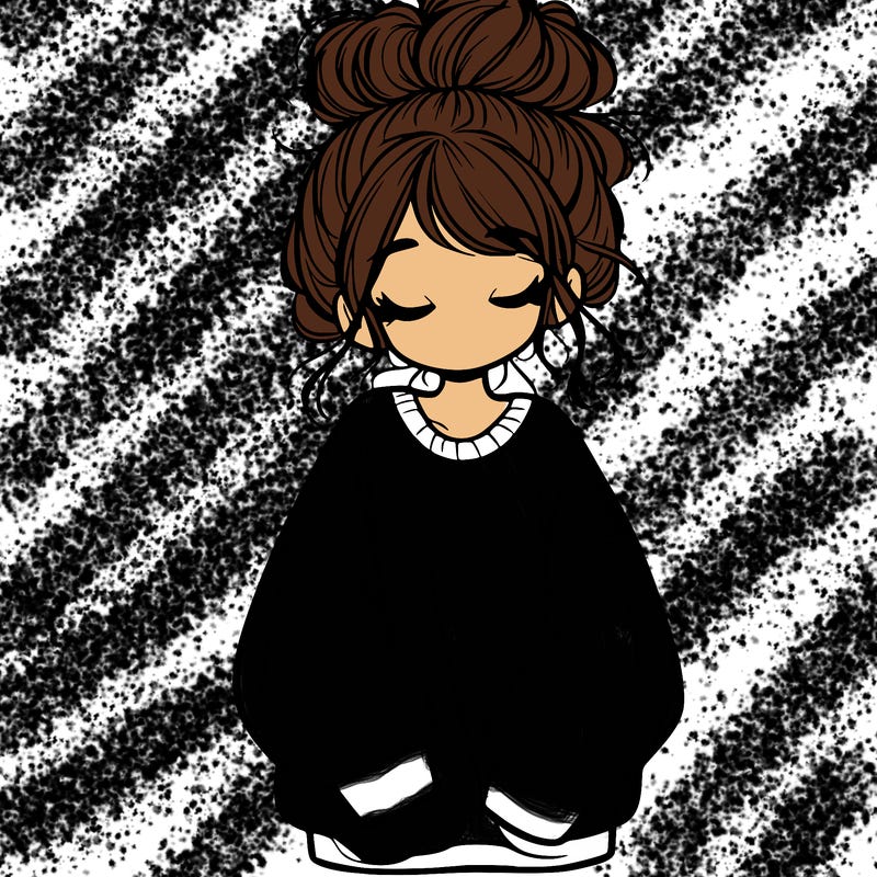 girl with baggy sweatshirt and messy bun