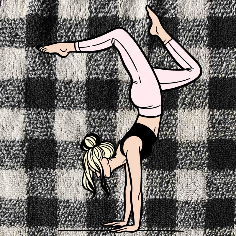 a woman doing a handstand