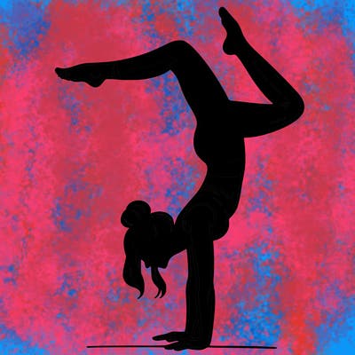 a woman doing a handstand