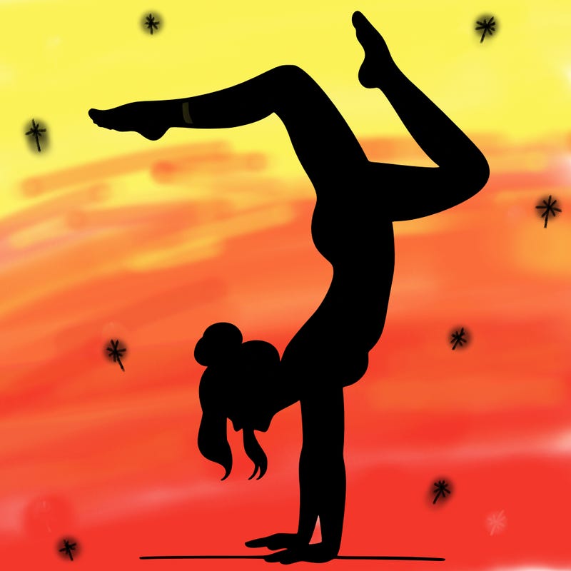 a woman doing a handstand