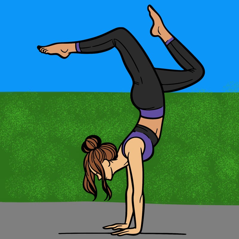a woman doing a handstand
