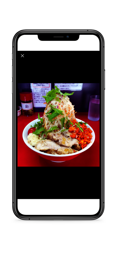 Authentic Jiro style ramen with large pork slices and a mountain of vegetable toppings