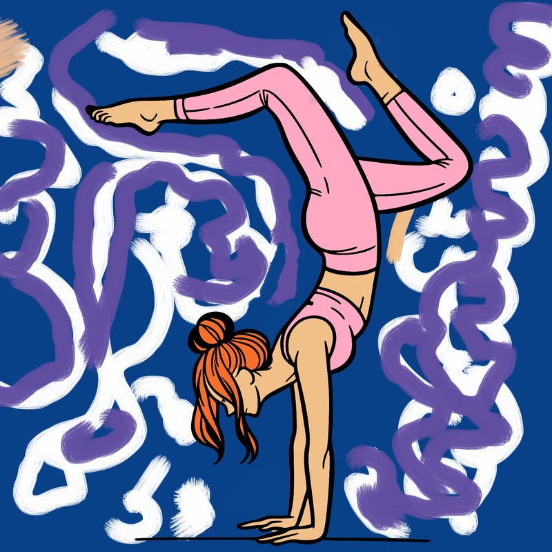 a woman doing a handstand