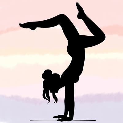 a woman doing a handstand