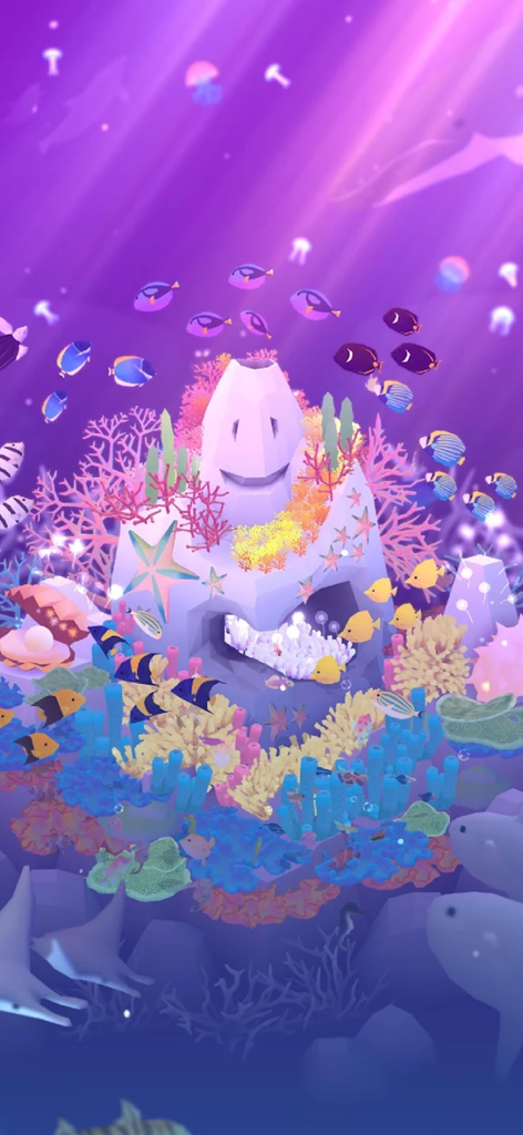 Tap Tap Fish - AbyssRium - A vibrant purple underwater scene in Tap Tap Fish AbyssRium featuring a smiling central rock surrounded by colorful coral and various swimming fish