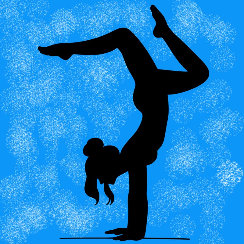 a woman doing a handstand