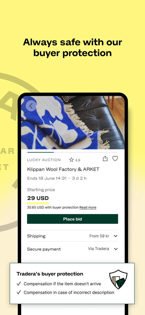 Tradera mobile app screen displaying an item auction for a wool blanket with details on buyer protection and secure payment options.
