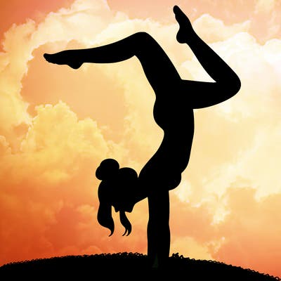 a woman doing a handstand