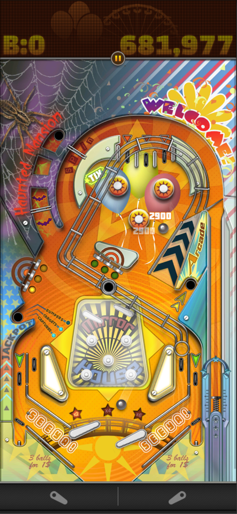 Pinball Deluxe Reloaded gameplay showing the Mirror House carnival table with flippers and a silver ball.
