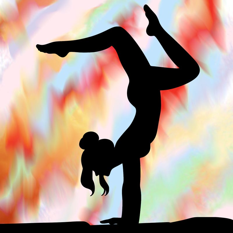a woman doing a handstand
