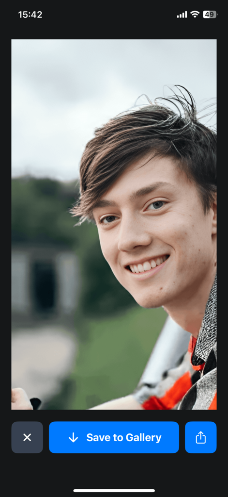 Photo Quality Enhancer FaceFix - AI enhanced portrait of a smiling man in the FaceFix app with a Save to Gallery option