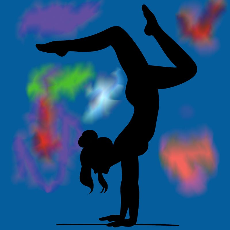 a woman doing a handstand