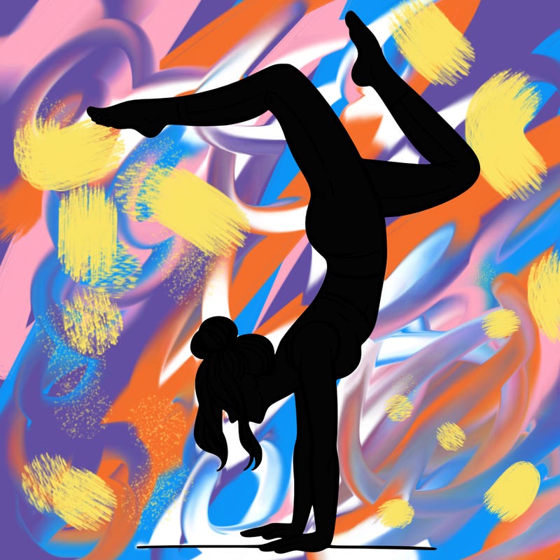 a woman doing a handstand