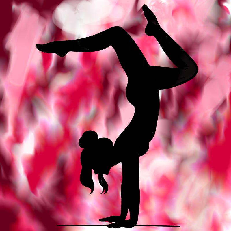 a woman doing a handstand