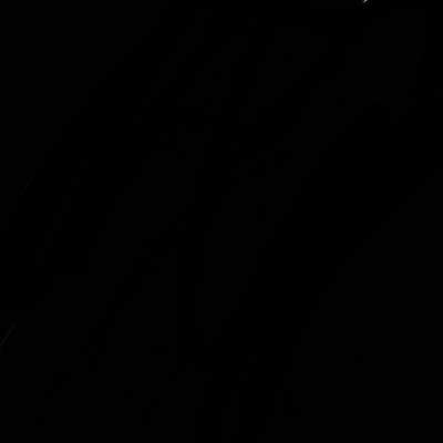 girl with a messy ponytail glasses a baggy crop top and jean shorts