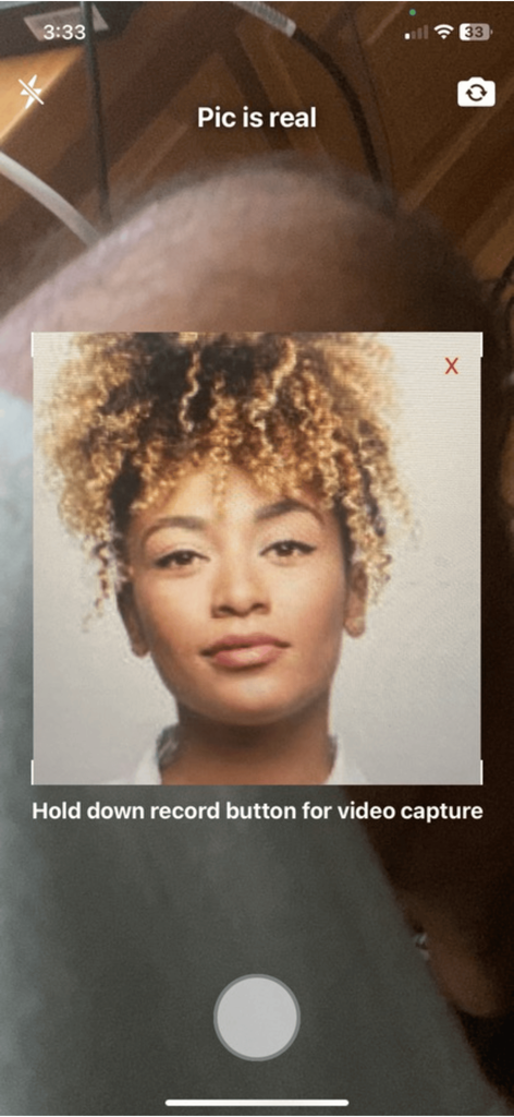 TruVideo - AI Detector - TruVideo app interface verifying a photo as real using on-device AI detection.