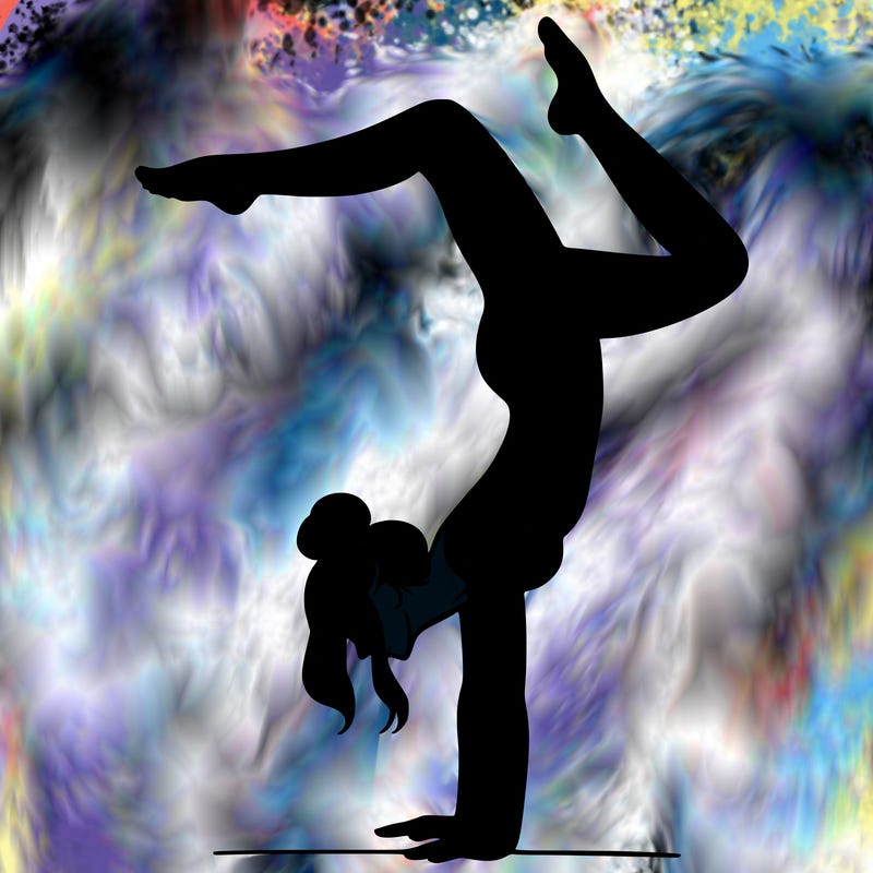 a woman doing a handstand