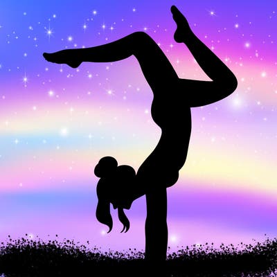 a woman doing a handstand