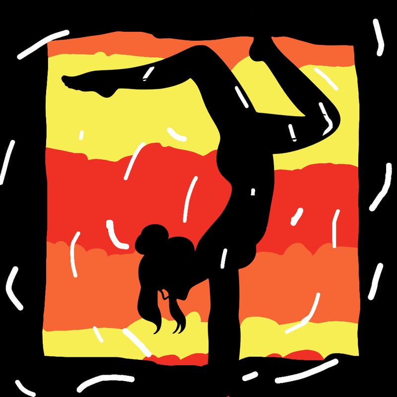 a woman doing a handstand