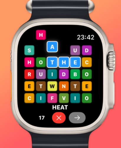 QuickWords - Word Puzzle Game - QuickWords word puzzle gameplay on Apple Watch showing colorful falling letter tiles forming the word HEAT.