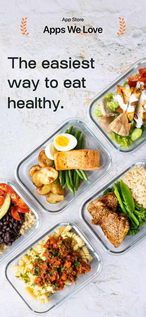 Glass meal prep containers filled with diverse healthy meals including salmon chicken and pasta
