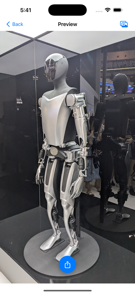 Interface of the Motion2Live app showing a preview of a silver humanoid robot photo