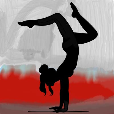 a woman doing a handstand