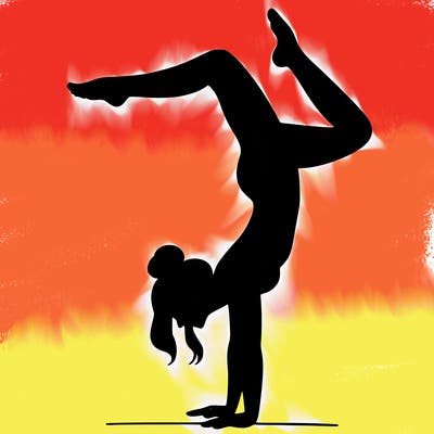 a woman doing a handstand