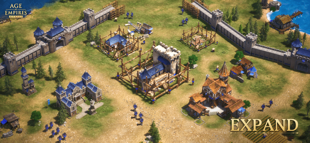 Age of Empires Mobile - Vista cenital de una ciudad medieval con murallas de piedra y edificios en construcción en Age of Empires Mobile