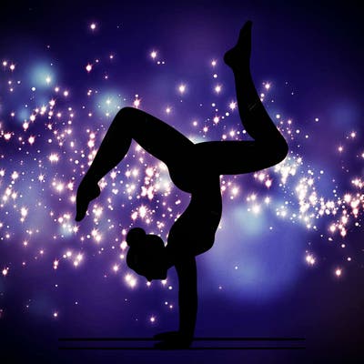 a woman doing a handstand