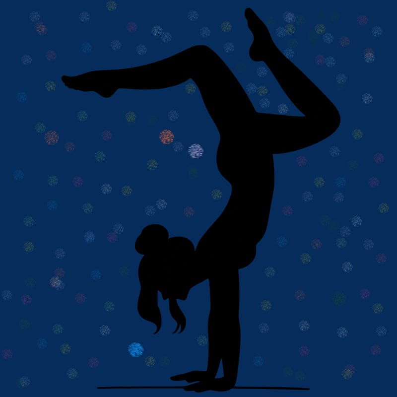 a woman doing a handstand