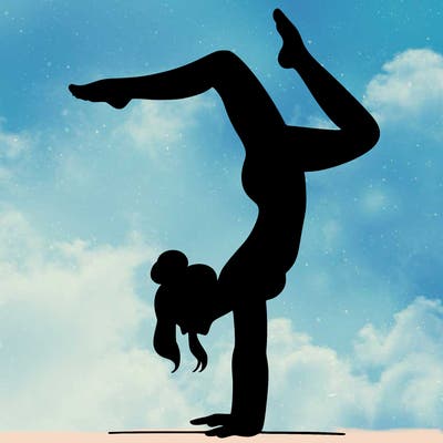 a woman doing a handstand