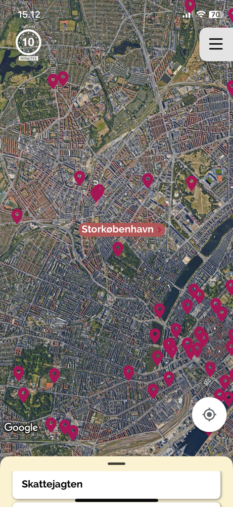 Satellite map of Copenhagen with pink location pins and a treasure hunt banner in the app