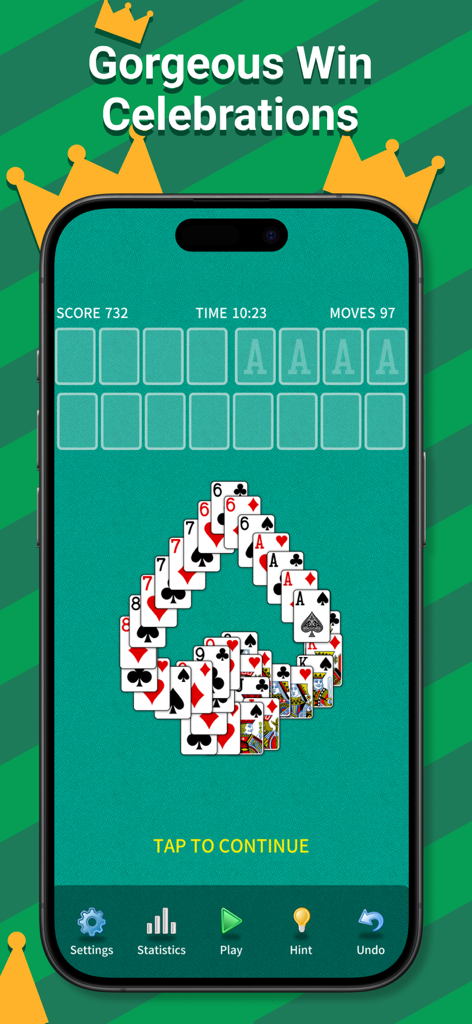 Screenshot of FreeCell Solitaire Classic showing a celebratory cascading card animation after winning a game.